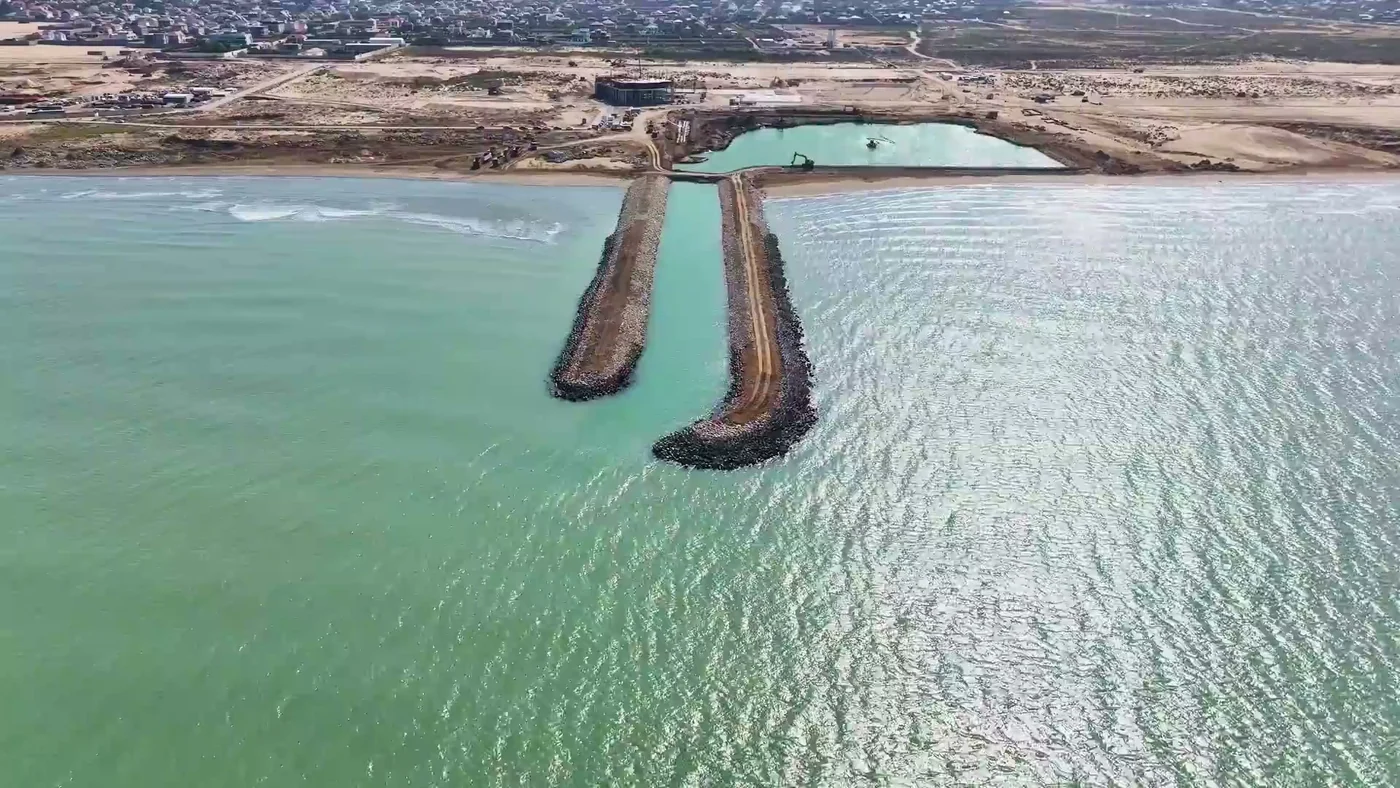 Two stone breakwaters and the entrance to the future harbor, November 2023